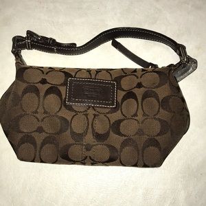A dark brown coach bag